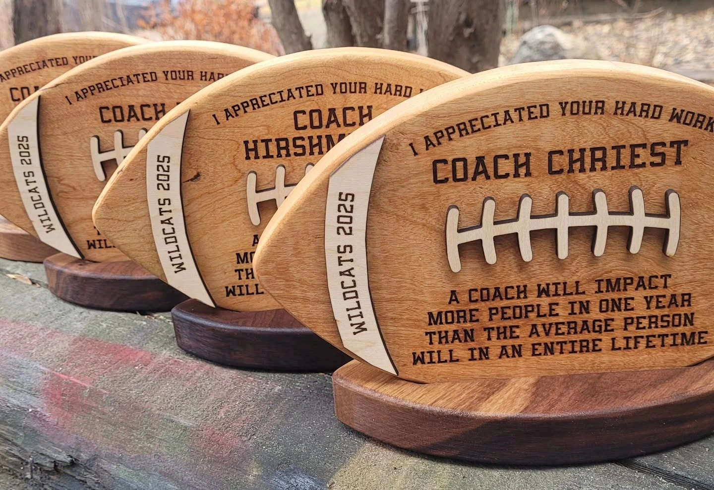 Round wood coach appreciation awards on display
