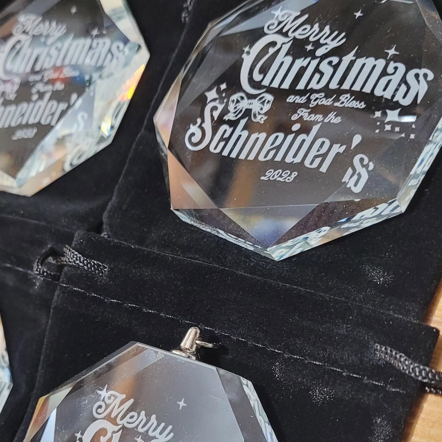 Faceted crystal Christmas ornaments with personalized engraved lettering